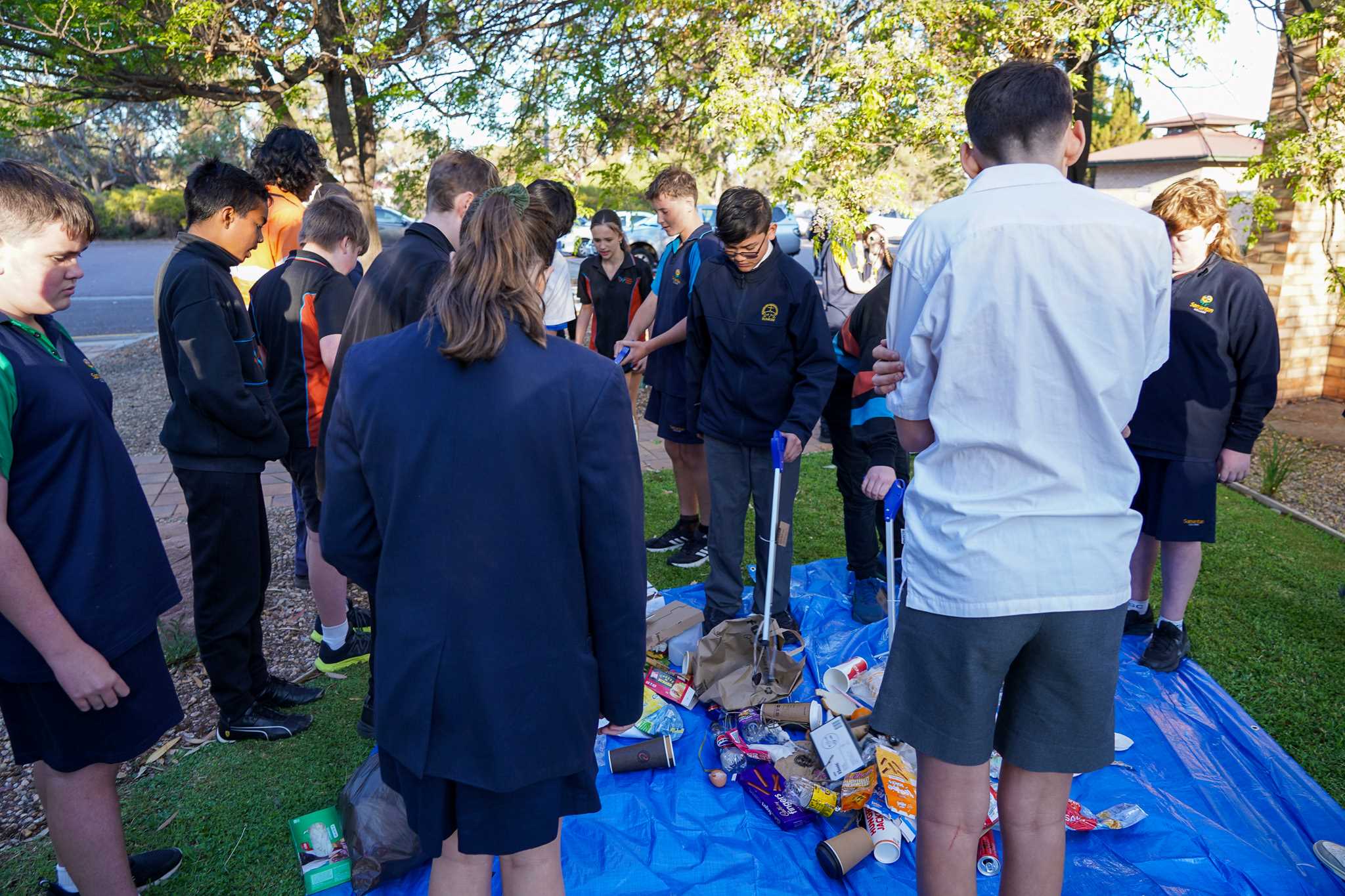 Students sorting through rubbish