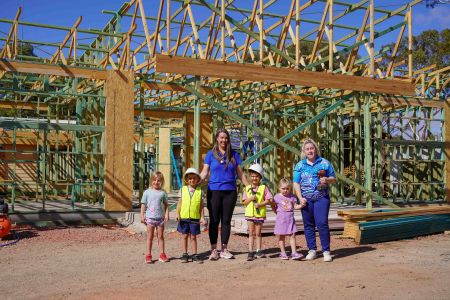 The Whyalla Child Care Centre upgrade is taking shape, with staff and children excited to see the ongoing progress. Pictured are, from left, Ivy, Ollie, Luna and Sadie, with Child Care staff Naomi Tarr and Lacey Groenveld.