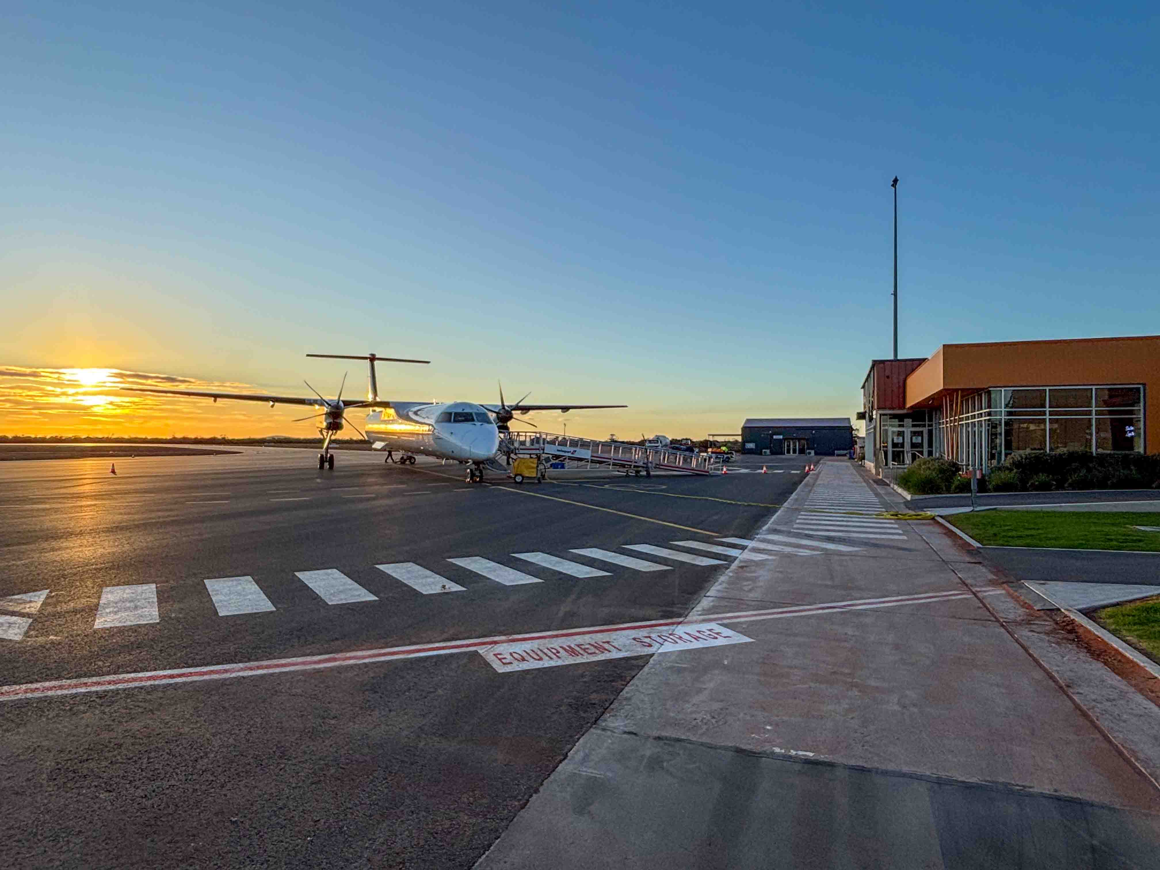 A plane loading on the newly laid asphalt apron