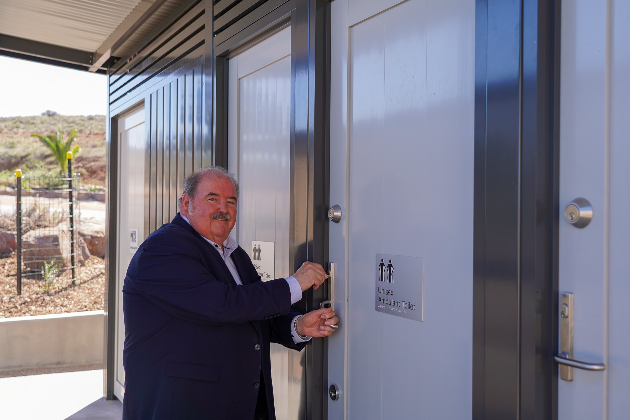 Mayor Phill Stone opening the toilets